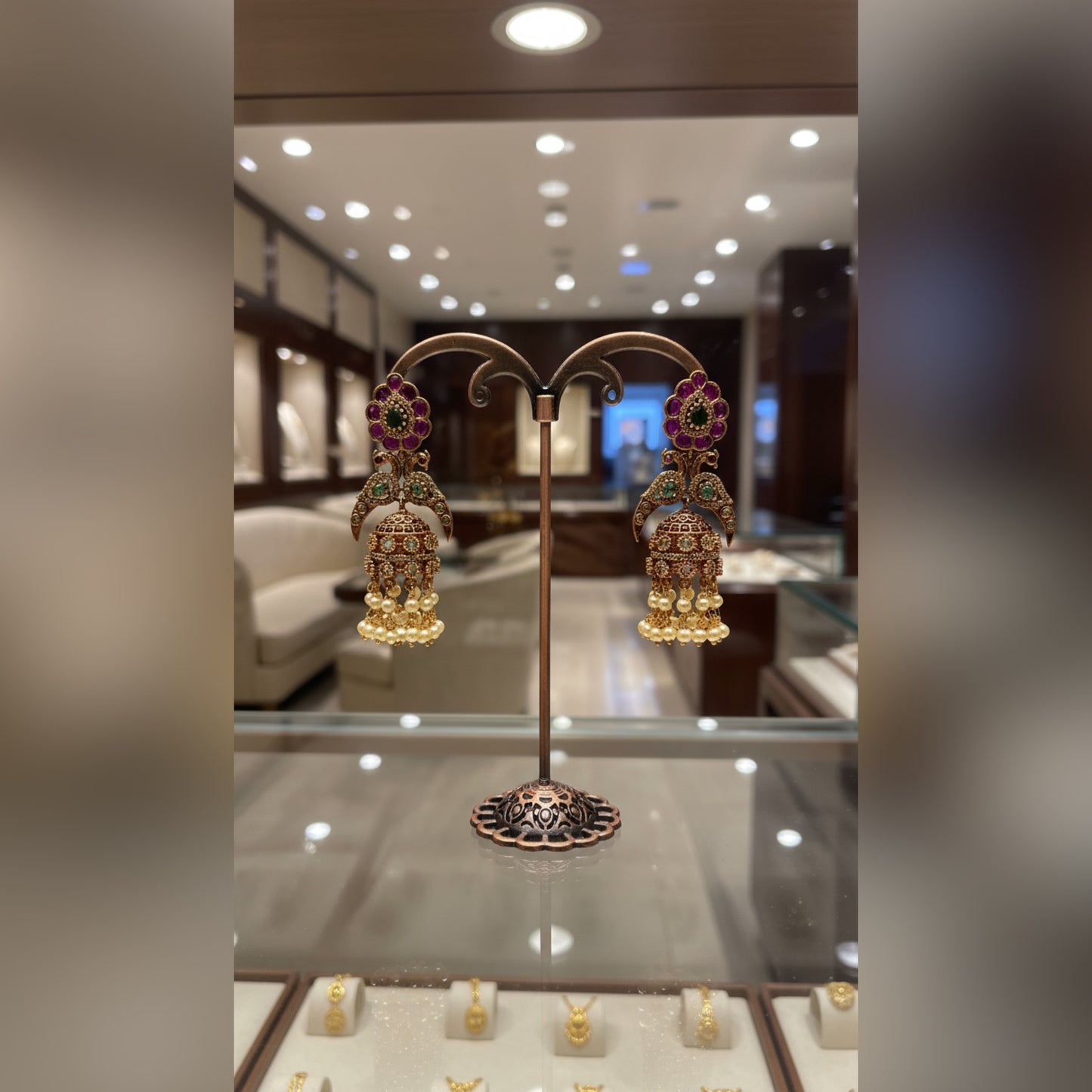 Traditional Gold Jhumka Earrings with Floral and Pearl Detailing