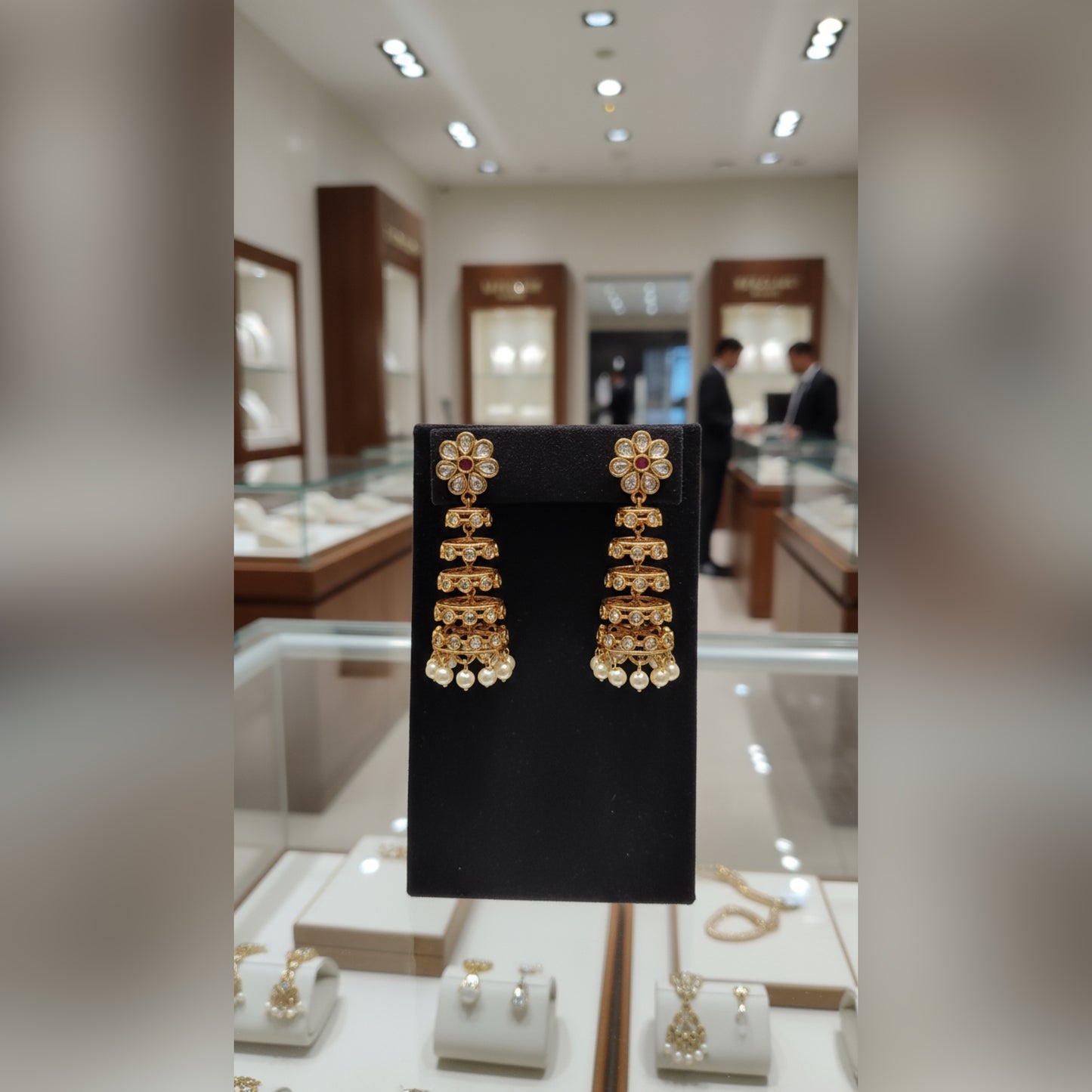 Regal Kundan Gold-Plated Jhumka Earrings with Pearl Drops